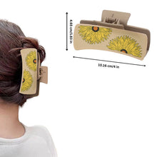 Load image into Gallery viewer, Woman wearing sunflower claw clip in bun hairstyle
